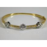 An 18ct gold bangle set with diamonds 22.5g