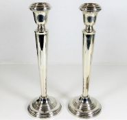A pair of silver candlesticks 10in tall 498g inclu