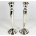 A pair of silver candlesticks 10in tall 498g inclu
