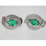 A pair of 18ct white gold earrings set with emeral