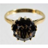 A 9ct gold ring with smokey quartz stone 3g size N