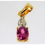 An 18ct gold diamond & ruby pendant 0.6g