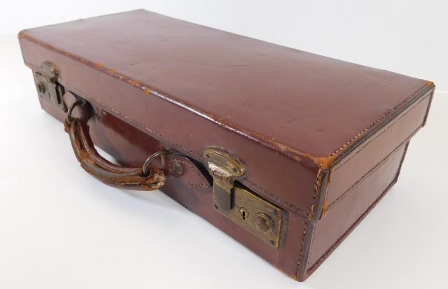 A small leather suitcase 15.75in long x 7in deep