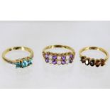 Three 9ct gold rings with mixed stones 6.7g