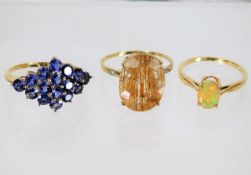 Three 9ct gold rings with mixed stones 7.1g