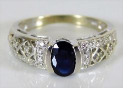 A 9ct white gold diamond & sapphire ring 3.4g size