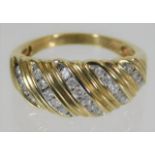 A yellow metal ring, tests as 9ct set with 0.5ct d