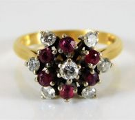 An 18ct gold ruby & 0.5ct diamond ring 4.7g size M