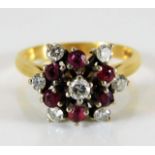 An 18ct gold ruby & 0.5ct diamond ring 4.7g size M