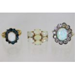 Three 9ct gold rings with opal style stones 12g