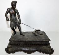 A mounted bronze figure on bronze plinth signed MG