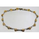 A two colour 18ct gold bracelet set with 1.5ct dia