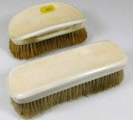 Two Victorian ivory clothes brushes