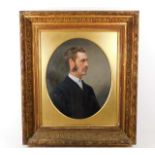 A c.1900 gilt framed oil of gentleman set with ova