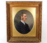 A c.1900 gilt framed oil of gentleman set with ova