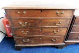 A Georgian oak chest of drawers with brass fitting