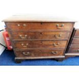 A Georgian oak chest of drawers with brass fitting