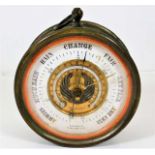 A brass aneroid barometer