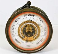 A brass aneroid barometer