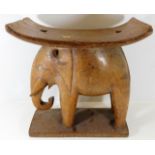 An early 20thC. carved elephant seat 17.25in wide