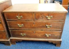 A Georgian oak chest of drawers with brass fitting