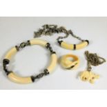 A set of ivory & white metal jewellery items