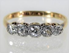 An antique 18ct gold ring set with five diamonds o