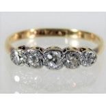 An antique 18ct gold ring set with five diamonds o