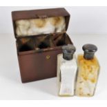 A leather scent bottle set with silver topped bott