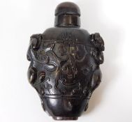 A 19thC. carved rhino horn Chinese scent bottle