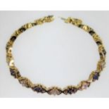 A 14ct gold diamond & sapphire bracelet 20.5g 7.5i