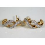 A pair of 9ct gold earrings set with diamonds 2.6g