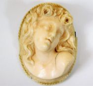 A 19thC. carved European ivory cameo, some faults