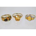 Three 9ct gold rings set with mixed stones 8.2g