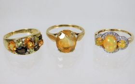 Three 9ct gold rings set with mixed stones 8.2g