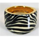 A 21ct gold ring with zebra print enamelled decor