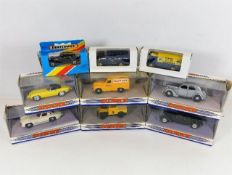 Nine boxed diecast toy cars including Matchbox, Co