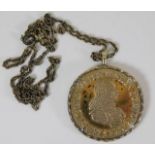 A chain with mounted coin medallion (approx. 35g e