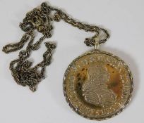 A chain with mounted coin medallion (approx. 35g e