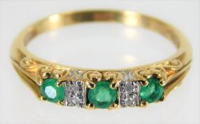 A 9ct gold diamond & emerald ring 2.1g size Q