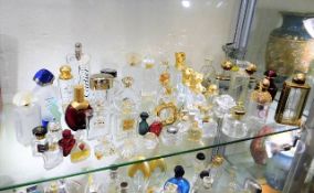 A quantity of perfume bottles including Lalique, C
