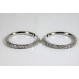 An 18ct white gold pair of earrings set with diamo