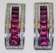 An 18ct white gold set of earrings set with ruby &