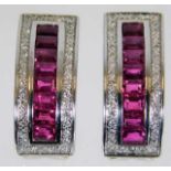 An 18ct white gold set of earrings set with ruby &