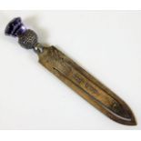 A silver bookmark with amethyst thistle finial