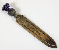 A silver bookmark with amethyst thistle finial