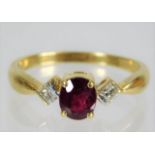 An 18ct gold ruby & diamond ring 2.9g size O
