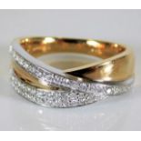 A 14ct two colour gold ring set with over forty di