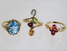 Three 9ct gold rings with mixed stones 11.2g