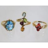 Three 9ct gold rings with mixed stones 11.2g